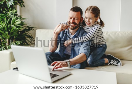 Similar – Image, Stock Photo Father working on laptop while child playing on kitchen floor