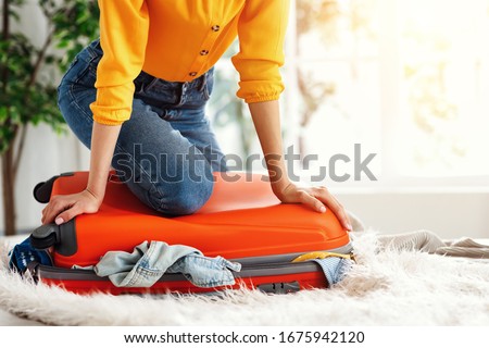 Similar – Image, Stock Photo Anonymous female with luggage walking in empty airport