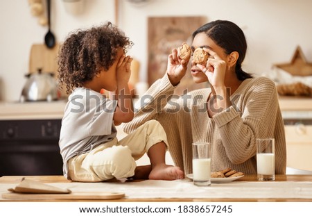 Similar – Image, Stock Photo Ethnic woman eating breakfast on bed