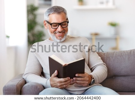 Similar – Image, Stock Photo Mature man reading book at home