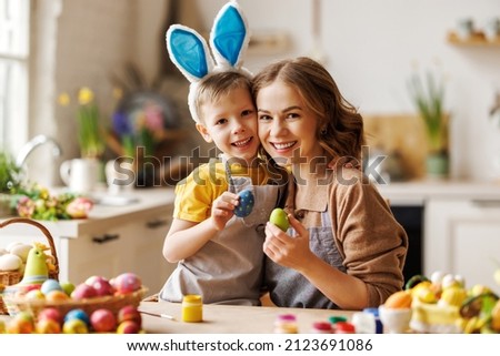 Image, Stock Photo A young mother teaches her little daughter to draw with colored pencils. Time together, creativity, education. Side view