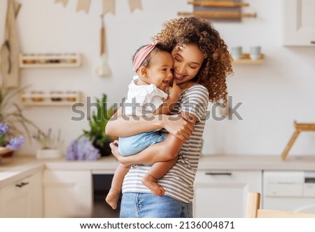 Similar – Image, Stock Photo Mother holding child