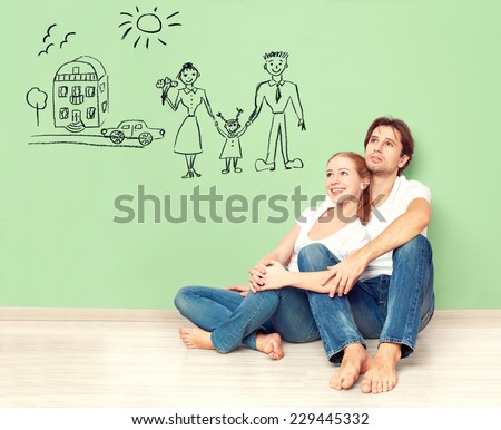concept. young happy family couple dreaming of new house, car, child, financial well-being