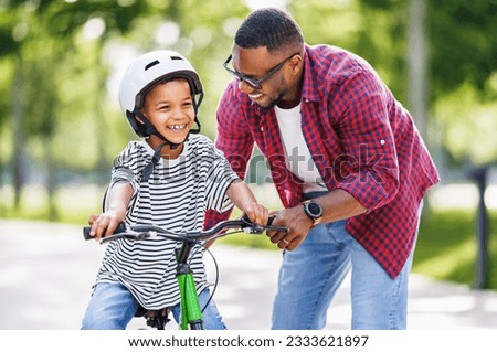 Similar – Image, Stock Photo man riding a bike, mode of transport doins exercise in Bilbao city Spain