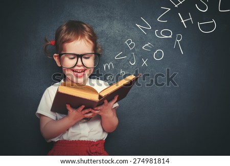 cute little girl with glasses reading a book with departing letters about Chalkboard
