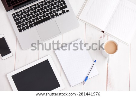 Workplace business still life. laptop, coffee, pen notebook