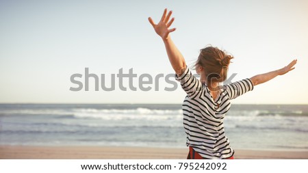 happy young woman enjoying freedom with open hands on sea Photo stock © 