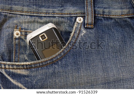 mobile phone in the pocket of jeans