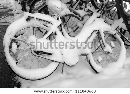 Bike fully covered with snow as the result of heavy snowfall in Europe.