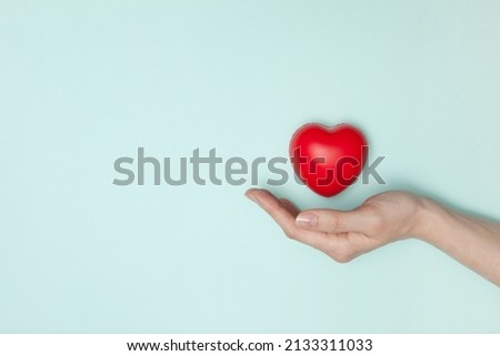 Similar – Image, Stock Photo Small red hearts on brown background