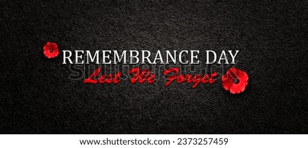 Remembrance Day Lest We Forget inscription with Poppy flower on black textured background. Decorative flower for Remembrance Day. Memorial Day. Veterans day. Foto stock © 