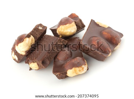 Stack of chocolate pieces with nut isolated on white background