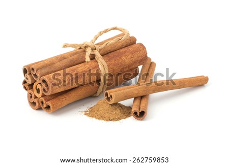 Cinnamon sticks with cinnamon powder isolated on white background