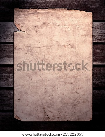 Old paper on brown wood texture, horizontal slats from a weathered bench with lighting