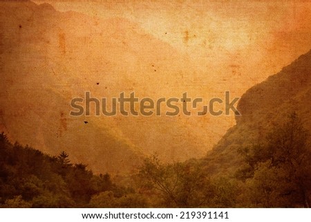Spectacular old vintage image on canvas material of misty mountainous valley scenery in the Italian lake district. Grungy vintage sepia background with texture