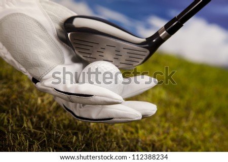 Hand and golf ball