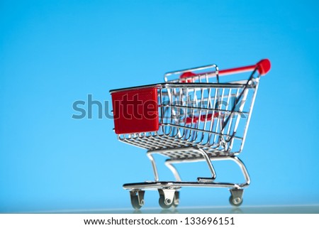 Shopping Cart Isolated On Blue