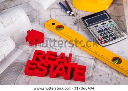 Real estate agency concept and blueprints