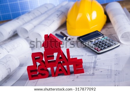 Real estate agency concept and blueprints
