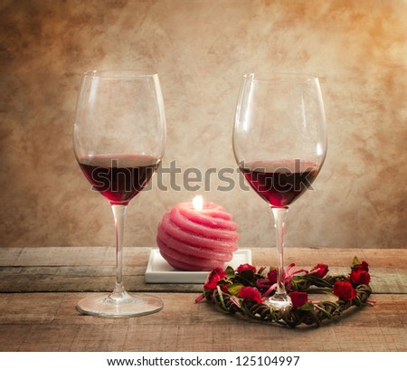red wine glasses in romantic atmosphere over sepia background