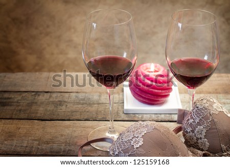 hot evening with wine glasses and sexy clothes