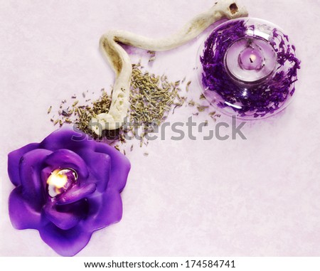 lavender background with dried flowers and candles