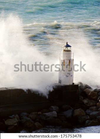 lighthouse and wave.