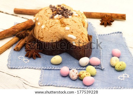 easter dove with chocolates over white wood