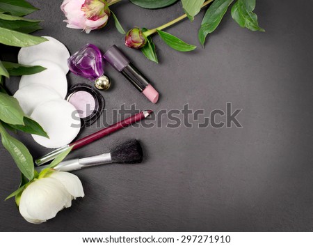 spa and cosmetic tools with peony flower and oil