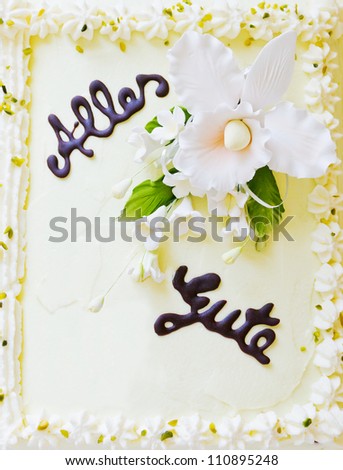 Detail of a decorated cake with letters made of chocolate