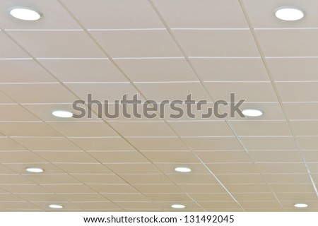 Detail of a white ceiling with integrated lightning