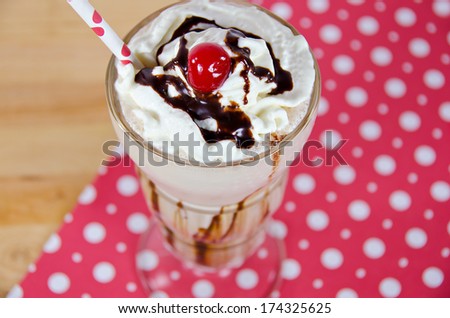 ice cream soda with polka dot straw