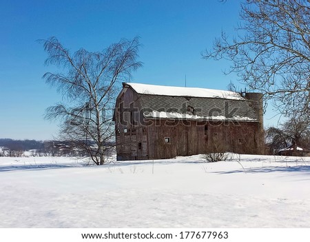 weathered old Michigan barn in winter