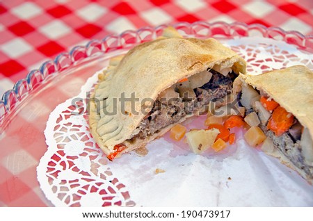 meat and vegetable pot pie on lace paper doily