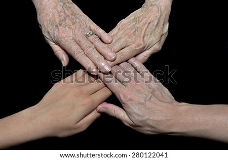 four family generations represented by human hands isolated on black