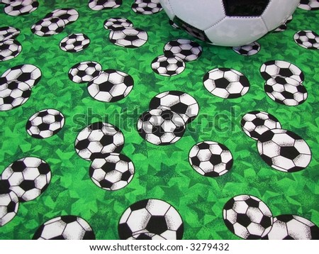 Soccer ball on colorful soccer ball design fabric