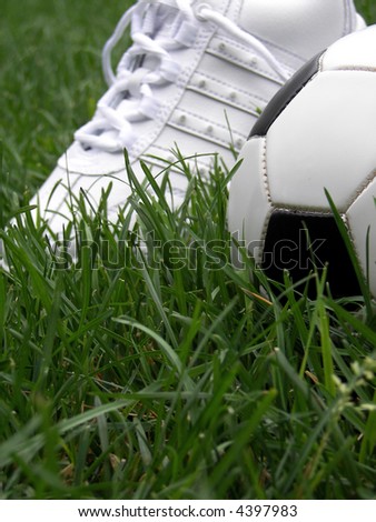 athletic shoe with soccer ball