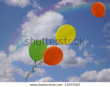 rainbow and balloons in sky