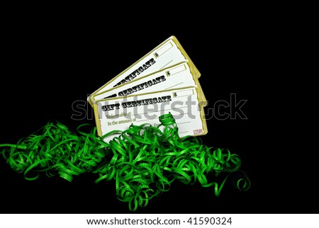 gift certificates in green curly ribbon