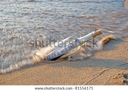 friendly message in a bottle on the beach