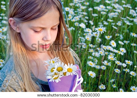 young girl with daisy bouquet in purple sneakers