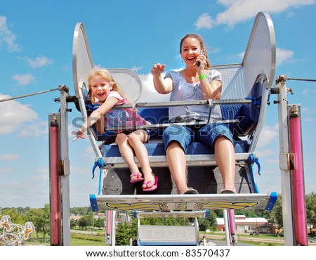 mother with child on ferris wheel