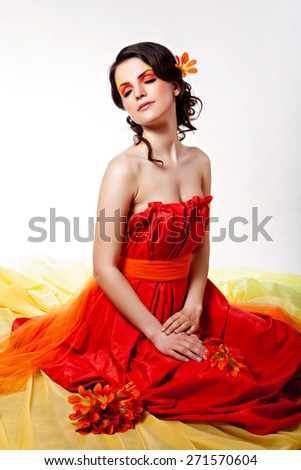 Fashion art portrait of a beautiful girl with shining skin and saturated fantasy make-up