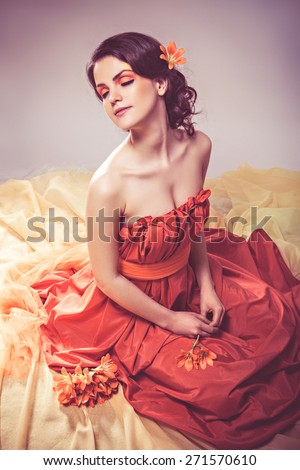 Fashion art portrait of a beautiful girl with shining skin and saturated fantasy make-up