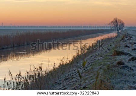 Sunrise in winter over a canal