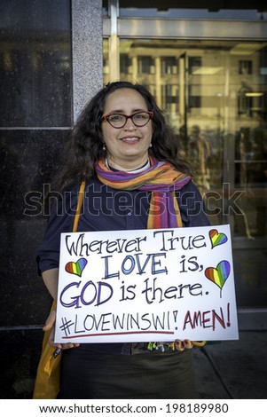 MADISON, WISCONSIN USA - JUNE 6: A gay marriage supporter  after a judge struck down Wisconsin\'s gay marriage ban on Friday June 6, 2014 in Madison, WI
