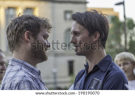 MADISON, WISCONSIN USA - JUNE 6: A gay couple getting married on the steps of the City County Building after a judge struck down Wisconsin\'s gay marriage ban on Friday June 6, 2014 in Madison, WI