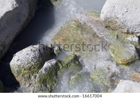 Mineral rich runoff from volcanic hot springs flowing over rocks in Lassen Volcanic National Park