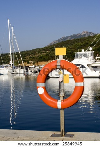 A life buoy at a yacht port.