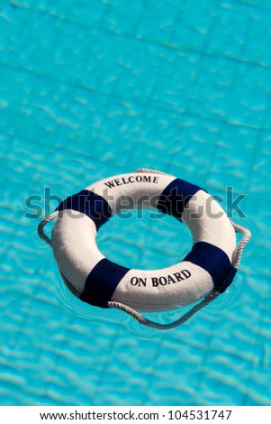 Life buoy floating in the swimming pool
